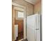 Kitchen featuring an entrance with a refrigerator, and a view of the sink area at 4715 E New York St, Indianapolis, IN 46201