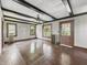 Large living room with decorative ceiling beams, radiator and a classic design at 4715 E New York St, Indianapolis, IN 46201