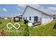 Spacious backyard with lush green grass, a patio, and a gazebo at 4726 Amber Wood Ln, Indianapolis, IN 46235