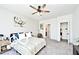 Comfortable bedroom with carpet flooring, a ceiling fan, and neutral paint color at 4726 Amber Wood Ln, Indianapolis, IN 46235