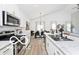 Bright kitchen featuring stainless appliances, white cabinets, and an island with seating at 4726 Amber Wood Ln, Indianapolis, IN 46235