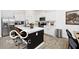 Bright kitchen showcasing an island with counter seating and stainless steel appliances at 4726 Amber Wood Ln, Indianapolis, IN 46235