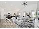 Open-concept living room boasts a large sectional sofa and vaulted ceilings at 4726 Amber Wood Ln, Indianapolis, IN 46235