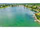 Aerial shot highlighting the waterfront neighborhood with boat docks and beautiful blue lake waters at 4810 Crystal River Ct, Indianapolis, IN 46240