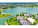 Wide aerial shot of residential lakeside community with lush landscaping and bridge at 4810 Crystal River Ct, Indianapolis, IN 46240