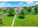 Aerial view of a home with a sprawling lawn, lush greenery, and stone pathway at 4810 Crystal River Ct, Indianapolis, IN 46240