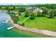 Breathtaking aerial view showcasing a lakefront property with lush greenery, a private dock, and serene waters at 4810 Crystal River Ct, Indianapolis, IN 46240