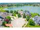 Aerial view of homes in a cul-de-sac overlooking a beautiful lake at 4810 Crystal River Ct, Indianapolis, IN 46240