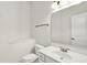 Clean and bright bathroom with a marble-top vanity and modern fixtures at 4810 Crystal River Ct, Indianapolis, IN 46240