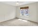 Bedroom featuring carpet and a window that provides natural light and neighborhood view at 4810 Crystal River Ct, Indianapolis, IN 46240