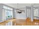 Bright living room with large windows, hardwood floors and a chandelier at 4810 Crystal River Ct, Indianapolis, IN 46240