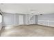 Open loft area with carpeted floors and a ceiling fan, offering a versatile living space at 4810 Crystal River Ct, Indianapolis, IN 46240