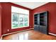 Office with large windows and stylish black bookcase offers ample storage at 4810 Crystal River Ct, Indianapolis, IN 46240