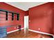 Red office featuring a desk and shelving, providing a versatile workspace at 4810 Crystal River Ct, Indianapolis, IN 46240