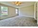 Spacious bedroom featuring neutral paint, plush carpet, and a ceiling fan at 5 Watson Dr, Trafalgar, IN 46181