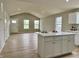 Open concept living room with luxury vinyl plank flooring and natural light at 5 Watson Dr, Trafalgar, IN 46181