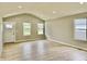 Living room featuring high ceilings, recessed lighting and luxury vinyl plank flooring at 5 Watson Dr, Trafalgar, IN 46181