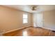 Bedroom with hardwood floors, neutral paint, and a window for natural light at 5119 Norwaldo Ave, Indianapolis, IN 46205