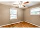 Bedroom with beautiful hardwood floors and plenty of natural light from two windows at 5119 Norwaldo Ave, Indianapolis, IN 46205