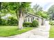 View of home with a concrete driveway and a detached garage to the rear at 5119 Norwaldo Ave, Indianapolis, IN 46205