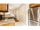 Cozy kitchen features stainless steel refrigerator and ample countertop space at 5119 Norwaldo Ave, Indianapolis, IN 46205