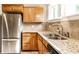 Bright kitchen featuring stainless steel refrigerator and a large double sink at 5119 Norwaldo Ave, Indianapolis, IN 46205