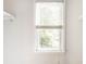 Sunlit window with wooden blinds offers pleasant natural light and outdoor views at 5119 Norwaldo Ave, Indianapolis, IN 46205
