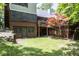 Backyard with lawn, stone features, and brick patio is ideal for relaxing and entertaining at 5530 Shawnee Trail South Dr, Indianapolis, IN 46220