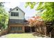 Exterior view of the home featuring a large backyard, patio, deck and mature shade trees at 5530 Shawnee Trail South Dr, Indianapolis, IN 46220