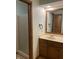 Bathroom featuring a single vanity and glass door shower at 5530 Shawnee Trail South Dr, Indianapolis, IN 46220
