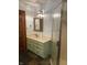 Bathroom with a framed mirror, single sink vanity, and glass door shower at 5530 Shawnee Trail South Dr, Indianapolis, IN 46220