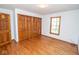 Bedroom with hardwood floors, large closet and bright natural light at 5530 Shawnee Trail South Dr, Indianapolis, IN 46220