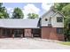 Charming home featuring a brick exterior, covered front entrance, and mature trees at 5530 Shawnee Trail South Dr, Indianapolis, IN 46220
