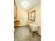 Laundry room with tile flooring, storage, utility sink and a window providing natural light at 5530 Shawnee Trail South Dr, Indianapolis, IN 46220