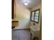 Laundry room with cabinets, counter and utility sink at 5530 Shawnee Trail South Dr, Indianapolis, IN 46220