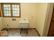 Practical laundry room includes a utility sink, storage cabinet and a window for natural lighting at 5530 Shawnee Trail South Dr, Indianapolis, IN 46220