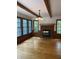 Inviting living room featuring a brick fireplace and large windows offering plenty of natural light at 5530 Shawnee Trail South Dr, Indianapolis, IN 46220