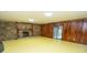 Spacious living room boasting a stone fireplace and sliding glass doors at 5530 Shawnee Trail South Dr, Indianapolis, IN 46220