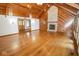 Spacious living room featuring a fireplace, hardwood floors, and vaulted ceilings at 5530 Shawnee Trail South Dr, Indianapolis, IN 46220