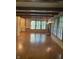 Inviting living room with hardwood floors, exposed beams, built-in shelving, a fireplace and natural light at 5530 Shawnee Trail South Dr, Indianapolis, IN 46220