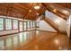 Bright living room with hardwood floors, staircase, and multiple windows for ample natural light at 5530 Shawnee Trail South Dr, Indianapolis, IN 46220