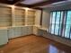 Bright office space featuring hardwood floors, built in shelving, and natural lighting at 5530 Shawnee Trail South Dr, Indianapolis, IN 46220