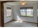 Bedroom with large windows, neutral walls, ceiling fan, and a cozy ambiance at 5632 Spring Mist Cir, Indianapolis, IN 46237