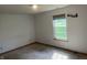 Bedroom featuring a large window offering natural light and a neutral color scheme at 5632 Spring Mist Cir, Indianapolis, IN 46237