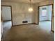 Dining room featuring neutral walls, vintage lighting, and easy access to adjacent rooms at 5632 Spring Mist Cir, Indianapolis, IN 46237