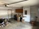 Garage space with a washer and dryer, overhead storage, and concrete flooring at 5632 Spring Mist Cir, Indianapolis, IN 46237