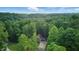 Picturesque aerial view of home nestled among lush green trees offering privacy and seclusion at 5824 Wesley Rdg, Martinsville, IN 46151