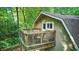 Balcony with wooden railing and furniture, providing a cozy outdoor space at 5824 Wesley Rdg, Martinsville, IN 46151