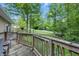 The wooden deck overlooks the backyard and tree setting, offering a relaxing outdoor space at 5824 Wesley Rdg, Martinsville, IN 46151
