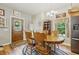 Traditional dining room with wooden table, chairs, chandelier, and natural light at 5824 Wesley Rdg, Martinsville, IN 46151